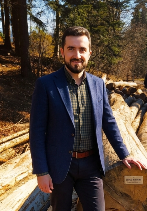 Master craftsman Marcin — founder of Five Colors of Wood beside seasoned oak timber